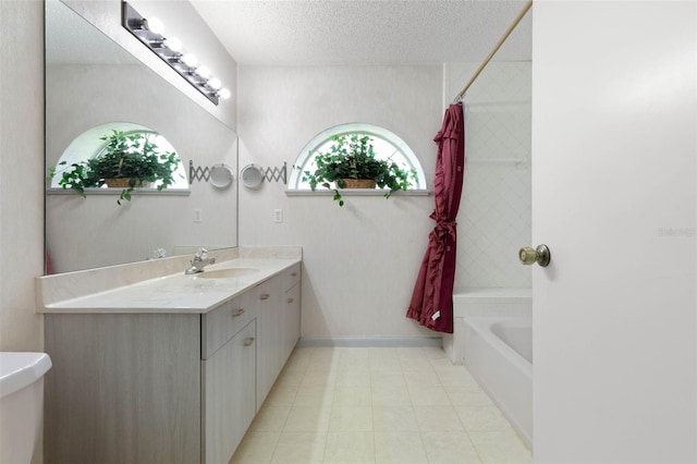 full bathroom featuring vanity, shower / bath combo, and a textured ceiling
