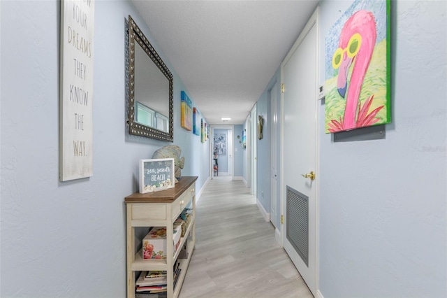 3580 S Ocean Shore Blvd Unit 210, Flagler Beach, FL 32136 - hall featuring light wood-style flooring and baseboards