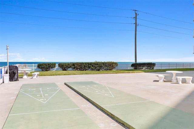 3580 S Ocean Shore Blvd Unit 210, Flagler Beach, FL 32136 - view of community with shuffleboard, fence, and a water view