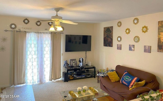 carpeted living area featuring ceiling fan
