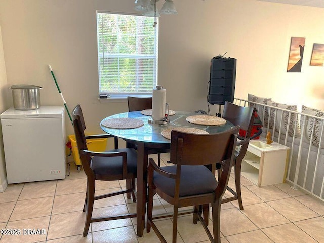 dining area with light tile patterned floors