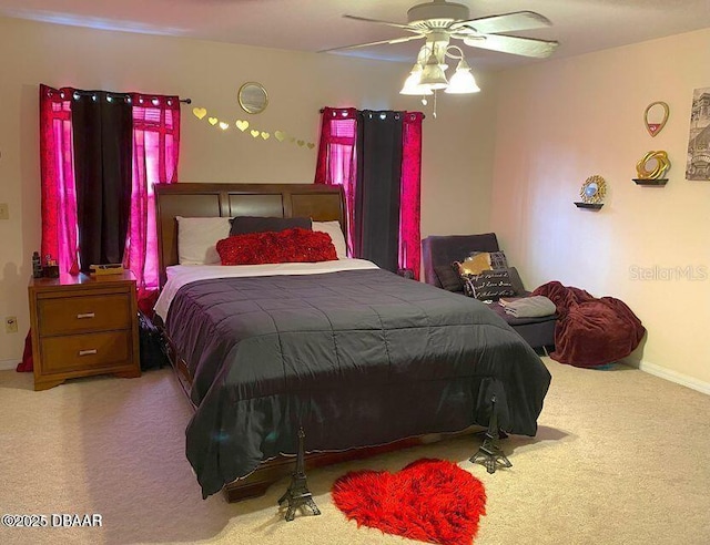 bedroom with carpet, baseboards, and ceiling fan