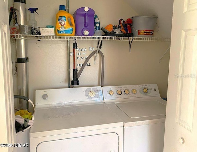 clothes washing area featuring washer and dryer