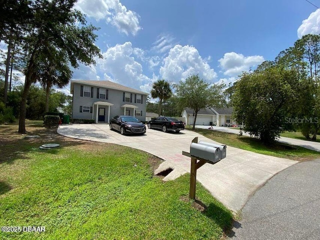 view of front of home with a front yard