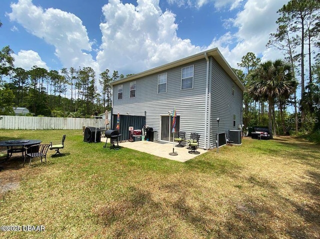 rear view of house featuring a patio and central air condition unit