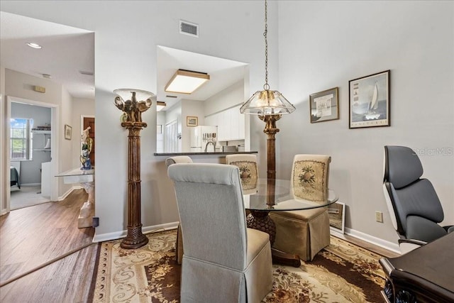 69 Rivers Edge Ln Unit 69, Palm Coast, FL 32137 - dining room with wood finished floors and baseboards