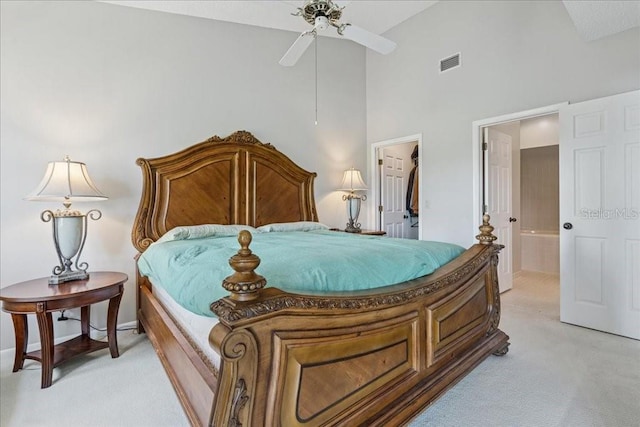 69 Rivers Edge Ln Unit 69, Palm Coast, FL 32137 - bedroom with light colored carpet, high vaulted ceiling, and baseboards