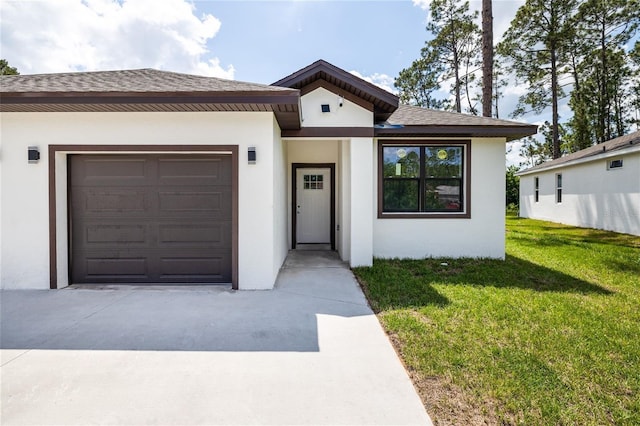 8 Bunker View Pl, Palm Coast, FL 32137 - view of front of home with stucco siding, a front yard, concrete driveway, a garage, and a shingled roof