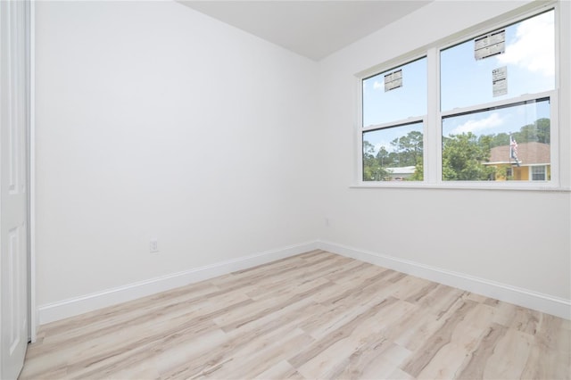 8 Bunker View Pl, Palm Coast, FL 32137 - empty room with baseboards and light wood-style flooring
