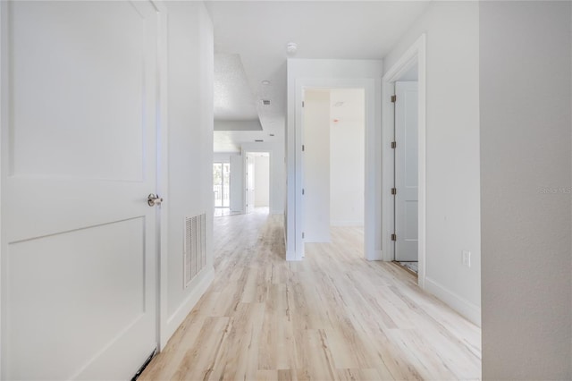 8 Bunker View Pl, Palm Coast, FL 32137 - hall with light wood-style floors and baseboards