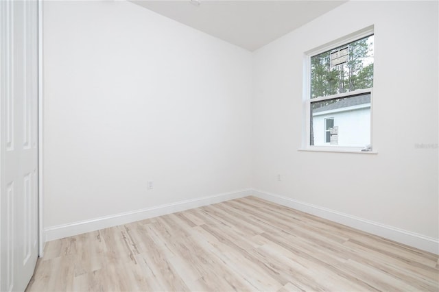 8 Bunker View Pl, Palm Coast, FL 32137 - unfurnished room featuring wood finished floors and baseboards