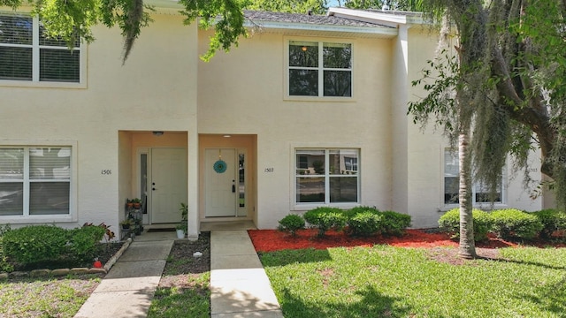 1502 Deer Springs Rd, Port Orange, FL 32129 - multi unit property featuring stucco siding and a front lawn