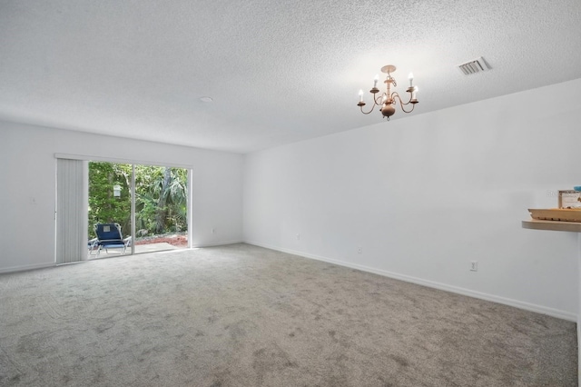 1502 Deer Springs Rd, Port Orange, FL 32129 - carpeted empty room with a chandelier, a textured ceiling, and baseboards