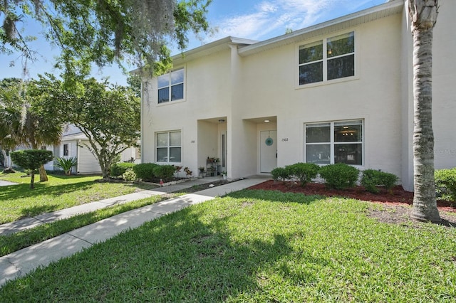 1502 Deer Springs Rd, Port Orange, FL 32129 - multi unit property with stucco siding and a front lawn