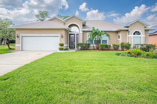 30 Westridge Ln, Palm Coast, FL 32164 - ranch-style house featuring a front yard, concrete driveway, an attached garage, and stucco siding