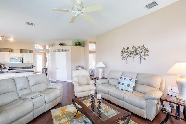 30 Westridge Ln, Palm Coast, FL 32164 - living room featuring wood finished floors, arched walkways, and a ceiling fan