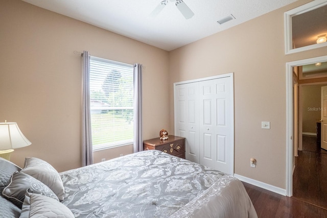 30 Westridge Ln, Palm Coast, FL 32164 - bedroom with dark wood-style floors, a closet, baseboards, and a ceiling fan