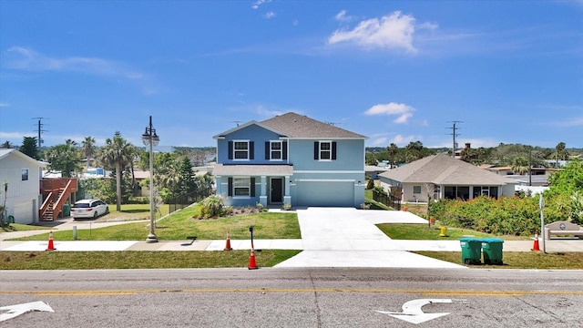 3828 S Atlantic Ave, Daytona Beach, FL 32118 - traditional home with driveway, a garage, a front lawn, and stucco siding
