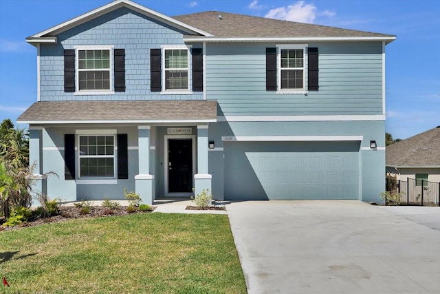 3828 S Atlantic Ave, Daytona Beach, FL 32118 - view of front facade with roof with shingles, a garage, concrete driveway, and stucco siding