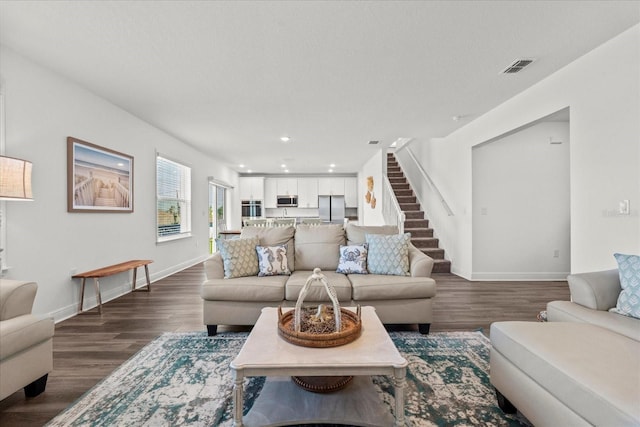 3828 S Atlantic Ave, Daytona Beach, FL 32118 - living area with dark wood-style flooring, stairs, and recessed lighting