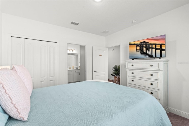 3828 S Atlantic Ave, Daytona Beach, FL 32118 - carpeted bedroom featuring baseboards and ensuite bathroom