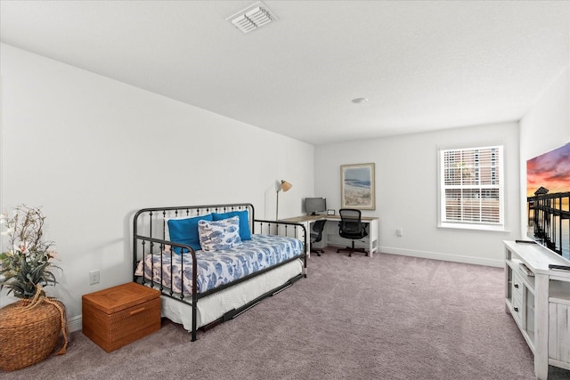 3828 S Atlantic Ave, Daytona Beach, FL 32118 - carpeted bedroom featuring an office area and baseboards