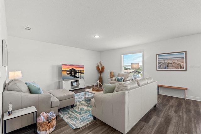 3828 S Atlantic Ave, Daytona Beach, FL 32118 - living room with dark wood-style floors and recessed lighting
