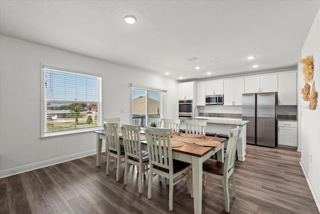3828 S Atlantic Ave, Daytona Beach, FL 32118 - dining space featuring wood finished floors, recessed lighting, and a textured ceiling
