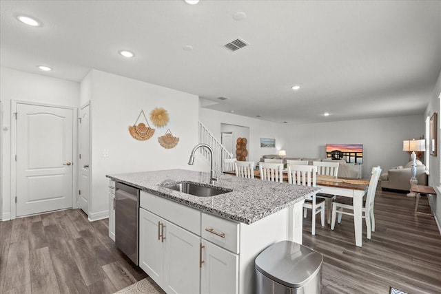 3828 S Atlantic Ave, Daytona Beach, FL 32118 - kitchen featuring dishwasher, dark wood finished floors, an island with sink, recessed lighting, and white cabinets