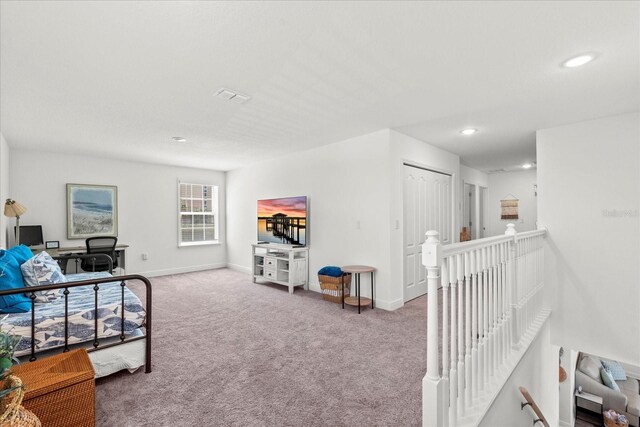 3828 S Atlantic Ave, Daytona Beach, FL 32118 - carpeted living room with baseboards and recessed lighting