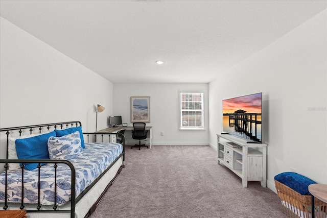 3828 S Atlantic Ave, Daytona Beach, FL 32118 - bedroom featuring a desk and carpet flooring