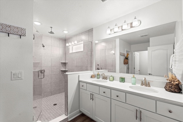 3828 S Atlantic Ave, Daytona Beach, FL 32118 - bathroom with a stall shower and double vanity