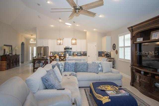 37 Lagoon Way, Palm Coast, FL 32137 - living area featuring a ceiling fan, lofted ceiling, and baseboards