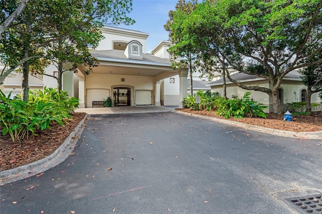 200 Riverfront Dr Unit B204, Palm Coast, FL 32137 - view of front of property featuring asphalt driveway and stucco siding