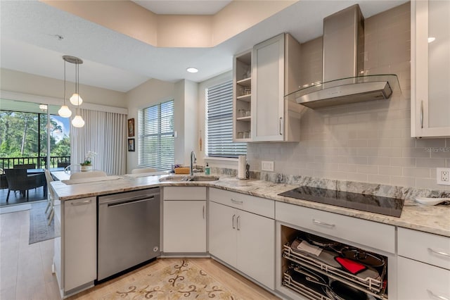 200 Riverfront Dr Unit B204, Palm Coast, FL 32137 - kitchen with stainless steel dishwasher, wall chimney exhaust hood, black electric cooktop, a sink, and a peninsula