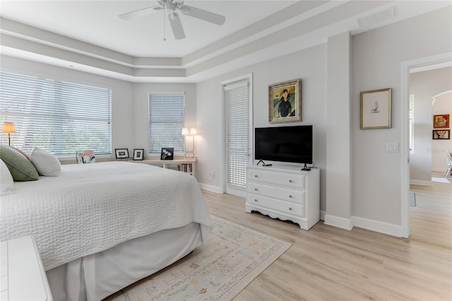 200 Riverfront Dr Unit B204, Palm Coast, FL 32137 - bedroom featuring baseboards, light wood-style flooring, and ceiling fan