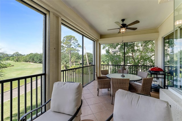 200 Riverfront Dr Unit B204, Palm Coast, FL 32137 - sunroom with a ceiling fan, golf course view, and outdoor dining space