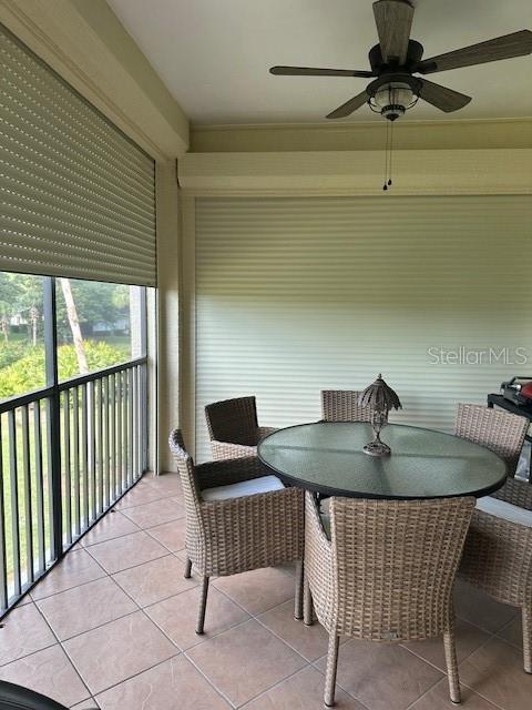 200 Riverfront Dr Unit B204, Palm Coast, FL 32137 - sunroom featuring ceiling fan and outdoor dining space