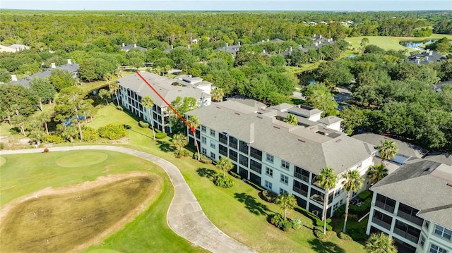 200 Riverfront Dr Unit B204, Palm Coast, FL 32137 - drone / aerial view of a local golf course, a nearby body of water, and a forest