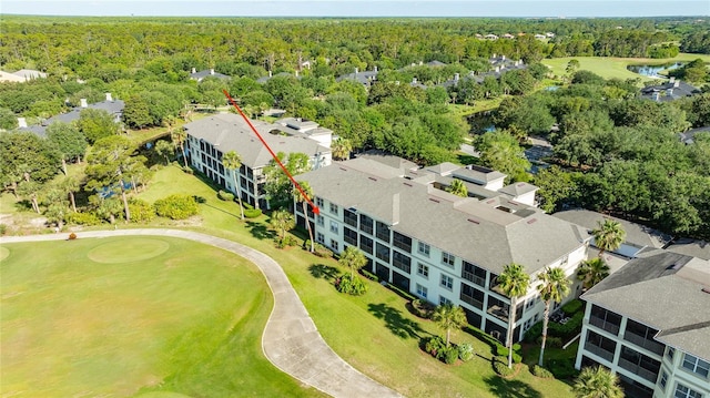 200 Riverfront Dr Unit B204, Palm Coast, FL 32137 - drone / aerial view of a golf course, a nearby body of water, and a forest