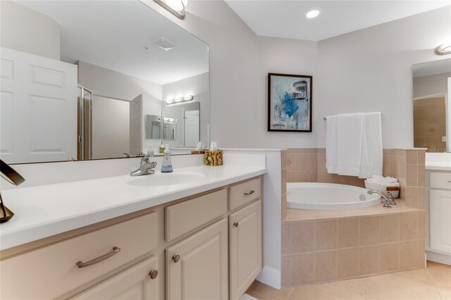 200 Riverfront Dr Unit B204, Palm Coast, FL 32137 - full bath with a garden tub, vanity, tile patterned flooring, and an enclosed shower