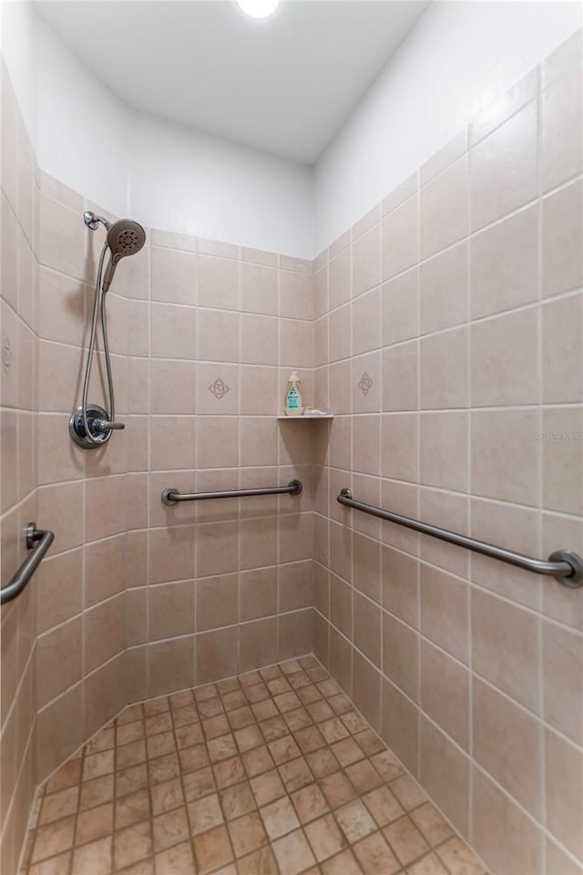 200 Riverfront Dr Unit B204, Palm Coast, FL 32137 - bathroom featuring a tile shower