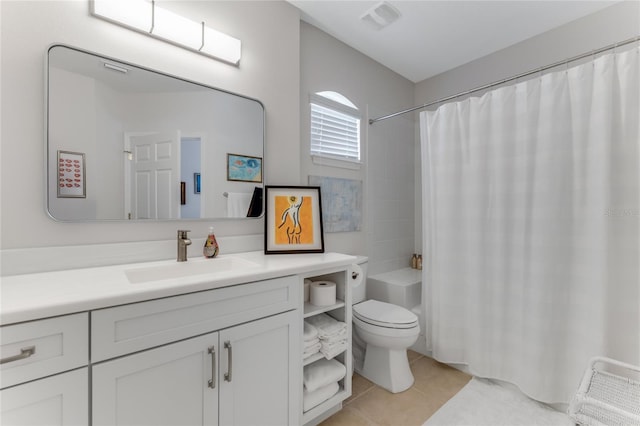 200 Riverfront Dr Unit B204, Palm Coast, FL 32137 - full bathroom with toilet, tile patterned floors, vanity, and shower / bathtub combination with curtain