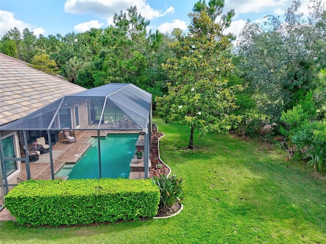 716 Woodbridge Ct, Ormond Beach, FL 32174 - view of grassy yard with a patio area, an outdoor pool, and glass enclosure