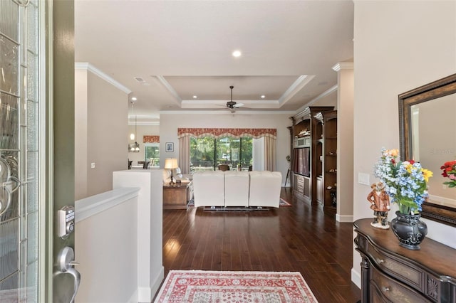 716 Woodbridge Ct, Ormond Beach, FL 32174 - foyer featuring a ceiling fan, wood-type flooring, a tray ceiling, ornamental molding, and recessed lighting