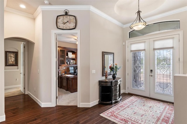 716 Woodbridge Ct, Ormond Beach, FL 32174 - foyer with french doors, arched walkways, dark wood-style floors, crown molding, and baseboards
