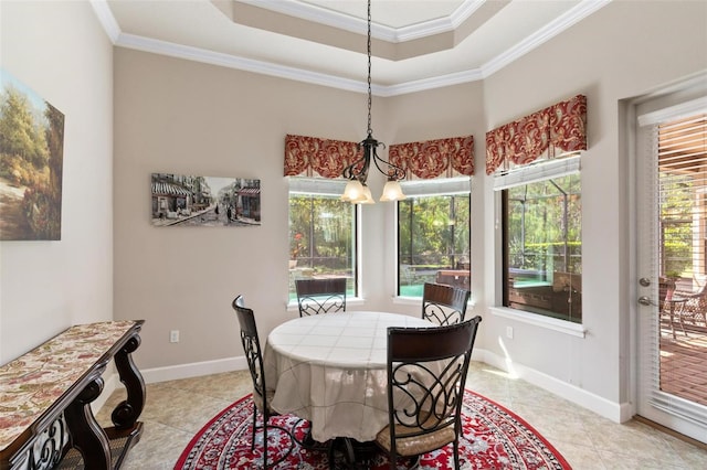 716 Woodbridge Ct, Ormond Beach, FL 32174 - dining area with light tile patterned flooring, ornamental molding, a raised ceiling, and baseboards