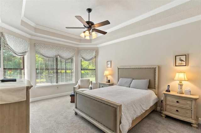 716 Woodbridge Ct, Ormond Beach, FL 32174 - carpeted bedroom featuring a raised ceiling, ornamental molding, baseboards, and ceiling fan