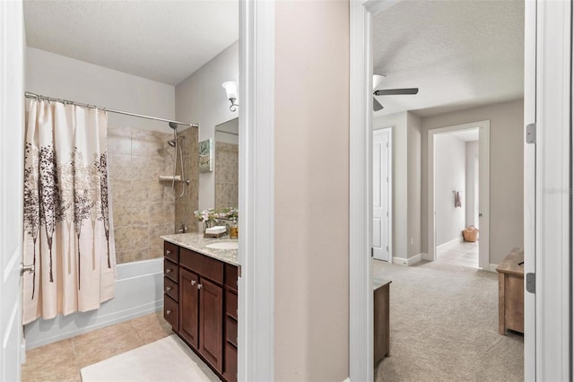 716 Woodbridge Ct, Ormond Beach, FL 32174 - bathroom featuring a textured ceiling, a ceiling fan, shower / bathtub combination with curtain, vanity, and tile patterned flooring