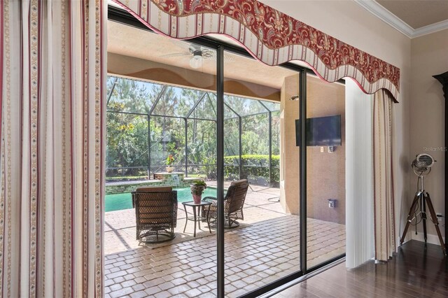 716 Woodbridge Ct, Ormond Beach, FL 32174 - doorway featuring a sunroom, ceiling fan, crown molding, and wood finished floors